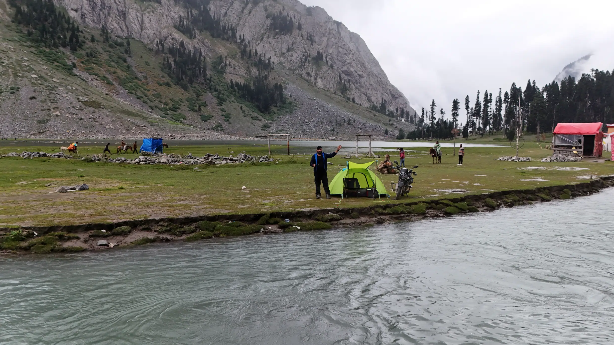 Motorcycle and camping setup at Mahodand Lake